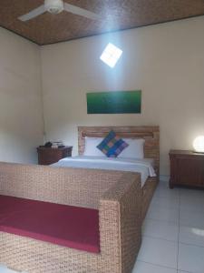 Postel nebo postele na pokoji v ubytování Rusma House Ubud