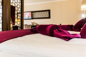 Postel nebo postele na pokoji v ubytování Paşapark Selçuklu Hotel