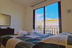 Katil atau katil-katil dalam bilik di Casa Palmera +62 gambar