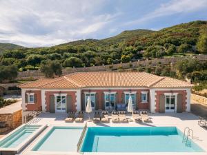 an image of a villa with a swimming pool at Archontiko Stoufi, an Authentic SeaView Retreat, By ThinkVilla in Skinária +55 photos