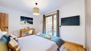 Μια τηλεόραση ή/και κέντρο ψυχαγωγίας στο Evasion Alpine - Vue imprenable & Confort Moderne