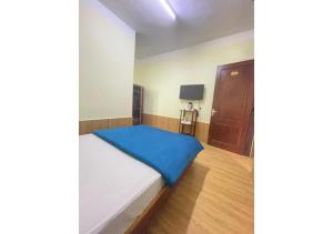 Postel nebo postele na pokoji v ubytování Hân Hoan Hotel