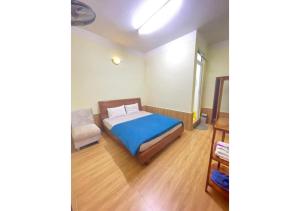 Postel nebo postele na pokoji v ubytování Hân Hoan Hotel