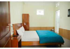 Postel nebo postele na pokoji v ubytování Hân Hoan Hotel
