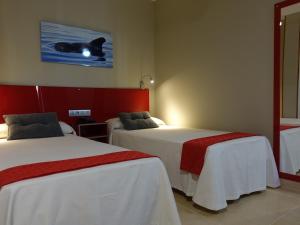 Postel nebo postele na pokoji v ubytování Hotel Andrea´s