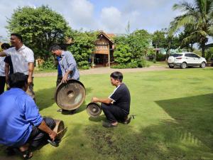 a group of men playing with a percussion instrument at Anna's Homestay Pleiku in Pleiku +113 photos