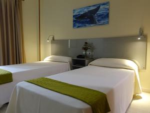 Postel nebo postele na pokoji v ubytování Hotel Andrea´s