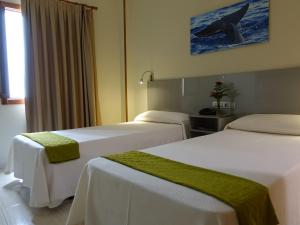 Postel nebo postele na pokoji v ubytování Hotel Andrea´s