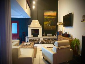 TV a/nebo společenská místnost v ubytování Bikeaway Guesthouse