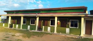 an old building with green paint on it at D'Tanjung Roomstay, Pekan Pahang in Pekan