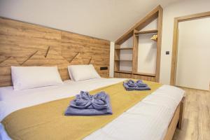 Postel nebo postele na pokoji v ubytování Resort Biela Skala - CHALETKA Chopok Jasná Juh