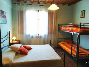 Ένα ή περισσότερα κρεβάτια σε δωμάτιο στο Casa il Borgo Toscano