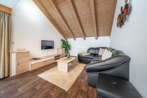 Televízia a/alebo spoločenská miestnosť v ubytovaní Appartement Köll