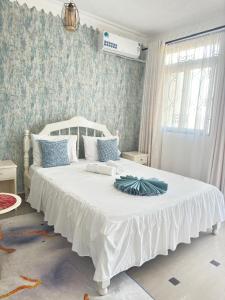 Una cama o camas en una habitación de ELLA STUDIO 68