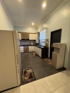 a kitchen that is being remodeled with appliances at Rumah Puteh Pekan in Pekan