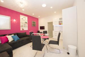 a living room with a couch and a table at Apartment Dea II in Split