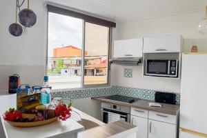 Ti Arums - Appt climatisé vue mer tesisinde mutfak veya mini mutfak