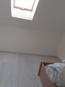 a room with a window and a box at Varkor Villa at the castle in Kőszeg