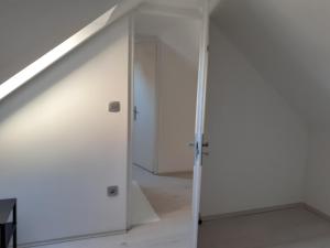 a room with a white door and a staircase at Varkor Villa at the castle in Kőszeg