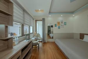 Postel nebo postele na pokoji v ubytování Dreamy Hotel Dalat