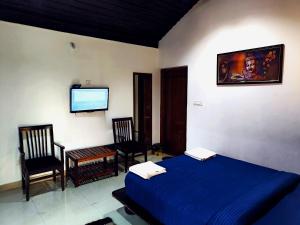 Postel nebo postele na pokoji v ubytování The Twin Cottages Coorg