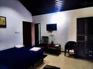 Postel nebo postele na pokoji v ubytování The Twin Cottages Coorg