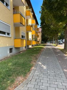 an empty street in front of a building at Apartments Neckarsulm in Neckarsulm