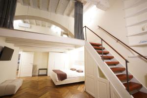 Ένα ή περισσότερα κρεβάτια σε δωμάτιο στο Loft moderno vista centro città J House