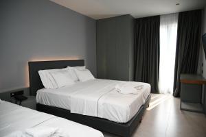 Postel nebo postele na pokoji v ubytování Adria Palace