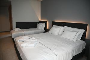 Postel nebo postele na pokoji v ubytování Adria Palace
