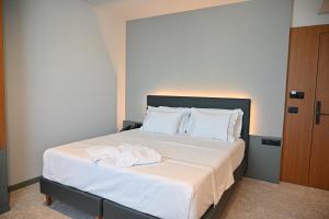 Postel nebo postele na pokoji v ubytování Adria Palace