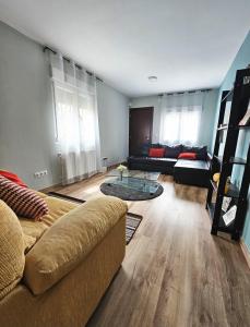 a living room with a couch and a table at Casa El Mirador in Trijueque
