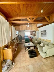 a living room with a couch and a table at Cortijo Luz de la Sierra in Dúdar