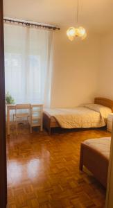 เตียงในห้องที่ Appartamento Armonia,rooms in the city +11 ภาพ