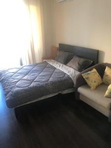 a bed and a couch in a bedroom at Bendita Mare Golden Sands Bulgaria in Golden Sands +17 photos
