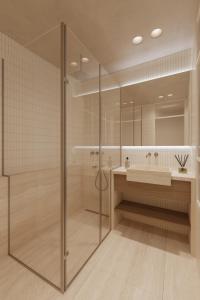 a bathroom with a glass shower and a sink at Luxury Living-Suite 1 in Athens
