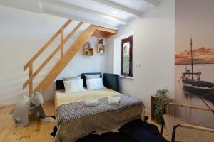 a bedroom with a bed in a room at Host Wise - Sunny Bright Duplexes & Pool in Vila Nova de Gaia +57 photos