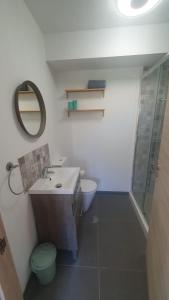 a bathroom with a sink and a toilet and a mirror at Casa Luna in Tolox +29 photos