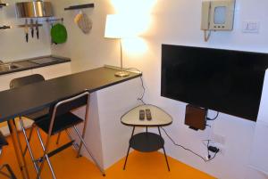 A television and/or entertainment centre at Duomo House