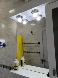 a bathroom with a shower and a mirror at Lam DEPARTAMENTO TEMPORARIO in Resistencia