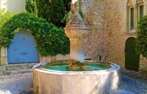 a water fountain in front of a building at Stunning Home In Vaison-La-Romaine in Vaison-la-Romaine +11 photos