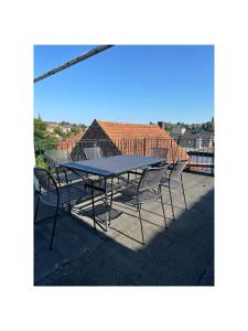 a table and chairs sitting on top of a balcony at Ankas´s Ferienwohnung in Bexbach