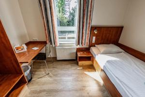 Postel nebo postele na pokoji v ubytování smartMotel + 19 fotografií