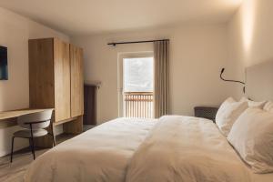 Postel nebo postele na pokoji v ubytování Pomella's Guesthouse