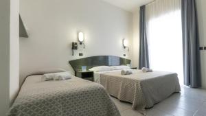 Postel nebo postele na pokoji v ubytování Hotel Nobel - Soft All Inclusive