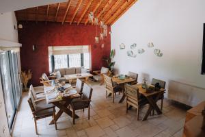 a dining room with wooden tables and chairs at VillaSkalaUrla in Urla