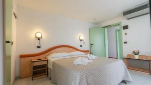 Postel nebo postele na pokoji v ubytování Hotel Nobel - Soft All Inclusive