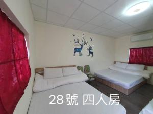 Voodi või voodid majutusasutuse Yilan B&B toas