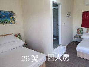 Voodi või voodid majutusasutuse Yilan B&B toas