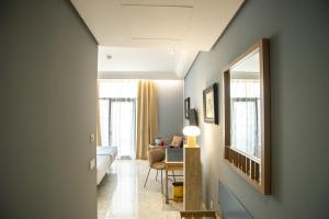 TV a/nebo společenská místnost v ubytování AZZ Mérida Medea Hotel